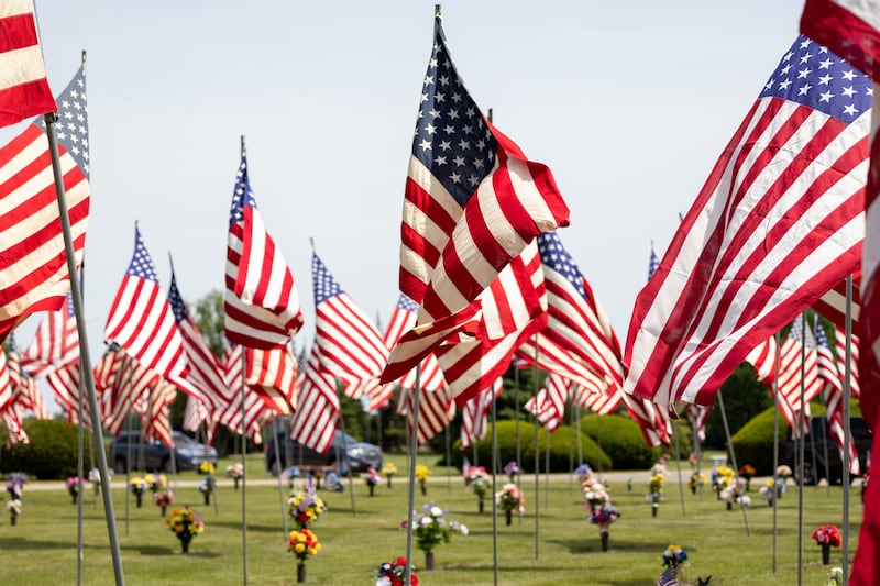 American flags wave at the annual Memorial Day service on Monday, May 26, 2025 at Valley Memorial Park in Spring Valley.