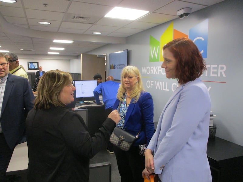 Caroline Portlock (left), director of the Workforce Investment Board of Will County, talks with Jackie Jiskra from Constellation Energy (right) and Elizabeth Gonzalez, chair of the Workforce Investment Board, at the new offices for the Workforce Center of Will County at 1300 Copperfield Ave., Joliet. April 27, 2026