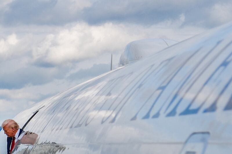 President Donald Trump disembarks Air Force One at Lehigh Valley International Airport, Friday, Aug. 1, 2025, in Allentown, Pa. (AP Photo/Julia Demaree Nikhinson)