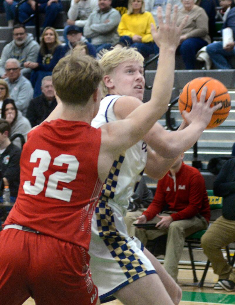 Marquette’s Luke McCullough works to get around Hall defender Chace Sterling (32) Saturday, Dec. 27, 2025, during the third-place game of Seneca's Shipyard Showdown.