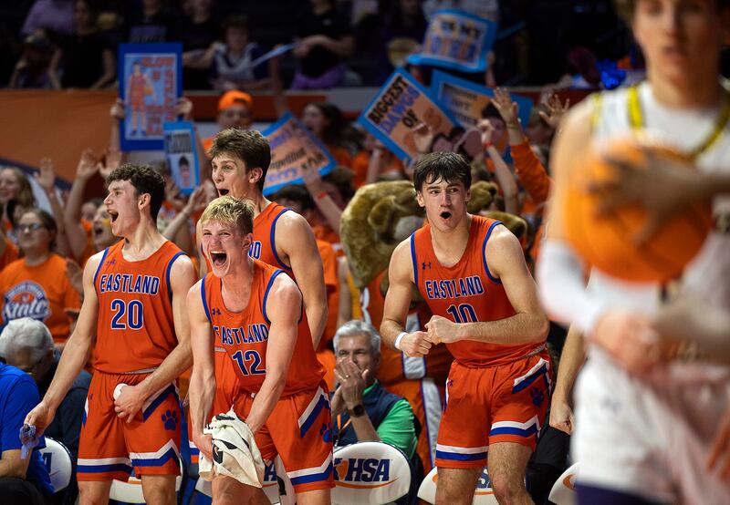 Eastland celebrates celebrates the final seconds of their win over Peoria Christian Thursday, March 13, 2025, during the Class 1A boys basketball state semifinal.