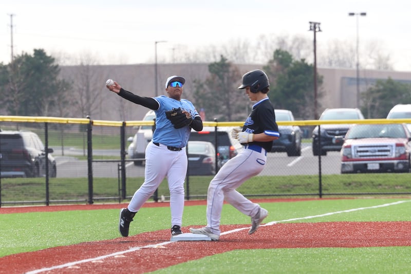 Kankakee's Johnny Short throws to first before the play is called foul during their game Peotone on Friday, April 3, 2026.