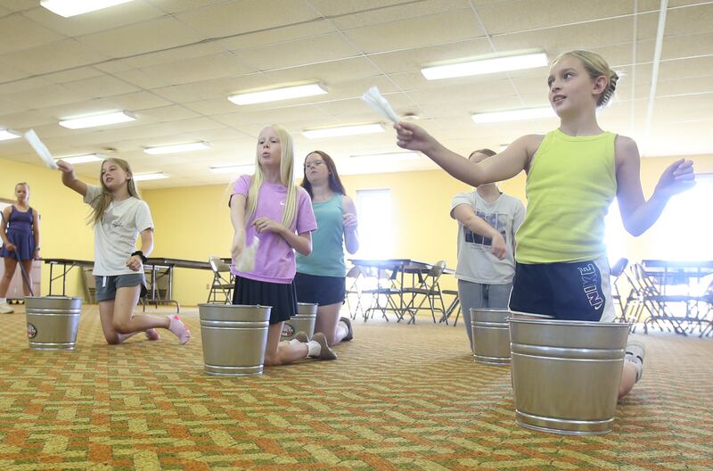 From left) Nora Glenn, Ryen Pettett, Ruby Stash, Sutter Dever, Gwynevere Maddex and Sophia Smith rehearse a scene for the upcoming musical Annie Jr. on Tuesday, June 24, 2025 at the First United Methodist Church in Henry. The show will be presented July 25-27 at the River Valley Players theater in Henry, .