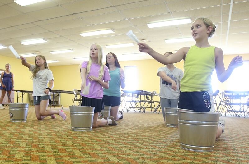 From left) Nora Glenn, Ryen Pettett, Ruby Stash, Sutter Dever, Gwynevere Maddex and Sophia Smith rehearse a scene for the upcoming musical Annie Jr. on Tuesday, June 24, 2025 at the First United Methodist Church in Henry. The show will be presented July 25-27 at the River Valley Players theater in Henry, .