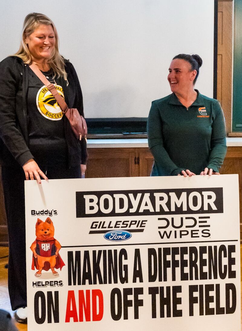 Plainfield East High School soccer coach Lisa Simon was honored by Buddy's Helpers as Mentor of the Month for her work with students in the community.