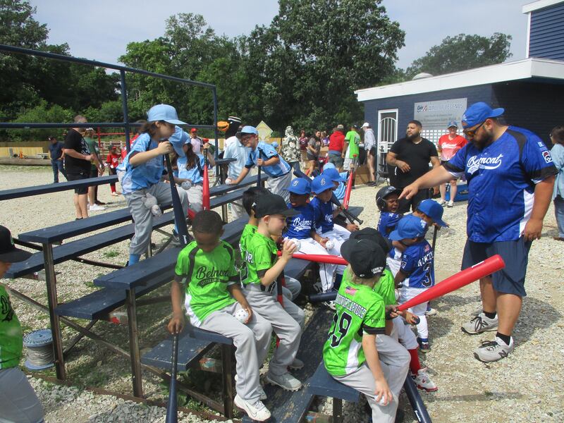 Belmont Little Leaguers gather with Coach  Lou Manzella at their ballpark in Joliet before getting a few hours of baseball instruction from Joliet Slammers representatives. June 14, 2025