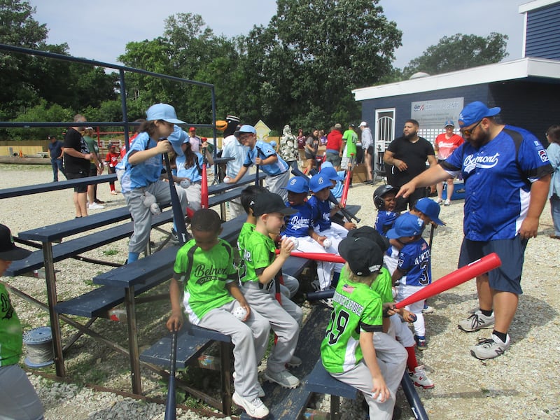 Belmont Little Leaguers gather with Coach  Lou Manzella at their ballpark in Joliet before getting a few hours of baseball instruction from Joliet Slammers representatives. June 14, 2025