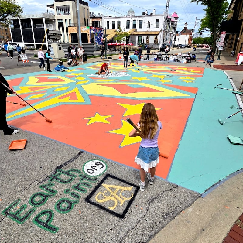 The fifth annual "Paint the Street" event in downtown St. Charles featured a high school student's design with an art deco flair.