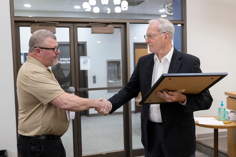 Mike Mills (left), commissioner of Veterans Memorial Park, shakes hands with Dixon Mayor Glen Hughes on Monday, March 3, 2025.