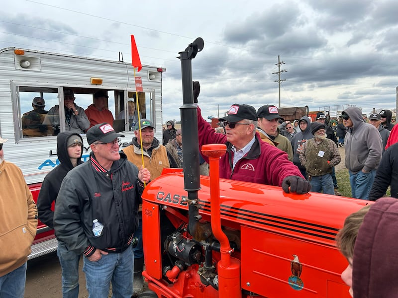 Auctioneer Lenny Bryson takes a bid on a 1949 Case tractor at the Hazelhurst Spring Sale on Saturday, April 5, 2025. The tractor was restored by Forreston FFA members. Dave Myers, of Leaf River Farms in Adeline, won the tractor in a raffle and put the tractor on the auction block, donating all the proceeds back to the Forreston FFA.