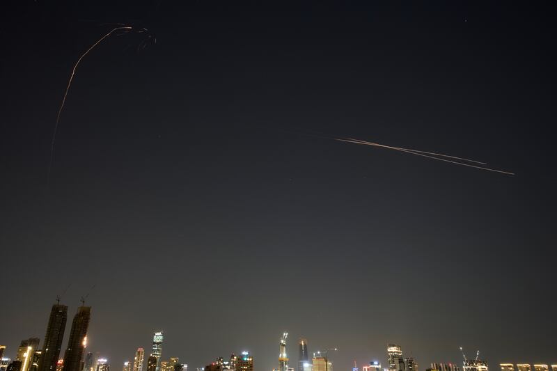 Israeli air defense system fires to intercept missiles during an Iranian attack over Tel Aviv, Israel, early Tuesday, March 3, 2026. (AP Photo/Ohad Zwigenberg)