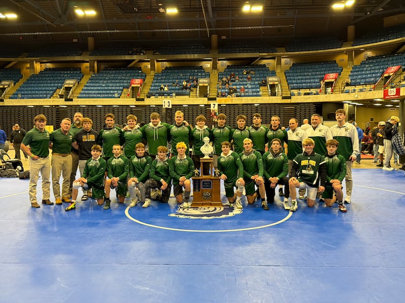 The Coal City boys wrestling team poses with their Abe's Rumble trophy on Dec. 30, 2025.