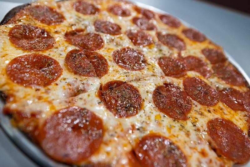 The Classroom specializes in a thin crust pizza.