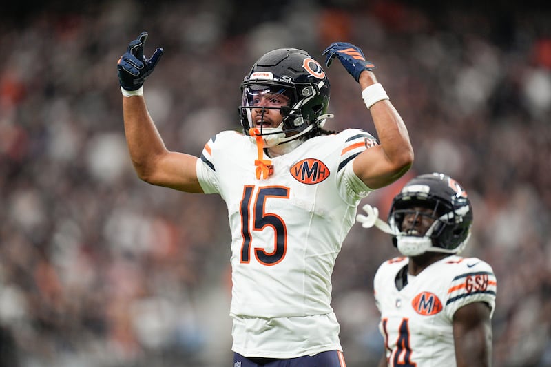 Chicago Bears wide receiver Rome Odunze (15) celebrates a touchdown during the second half of an NFL football game against the Las Vegas Raiders Sunday, Sept. 28, 2025, in Las Vegas. (AP Photo/John Locher)