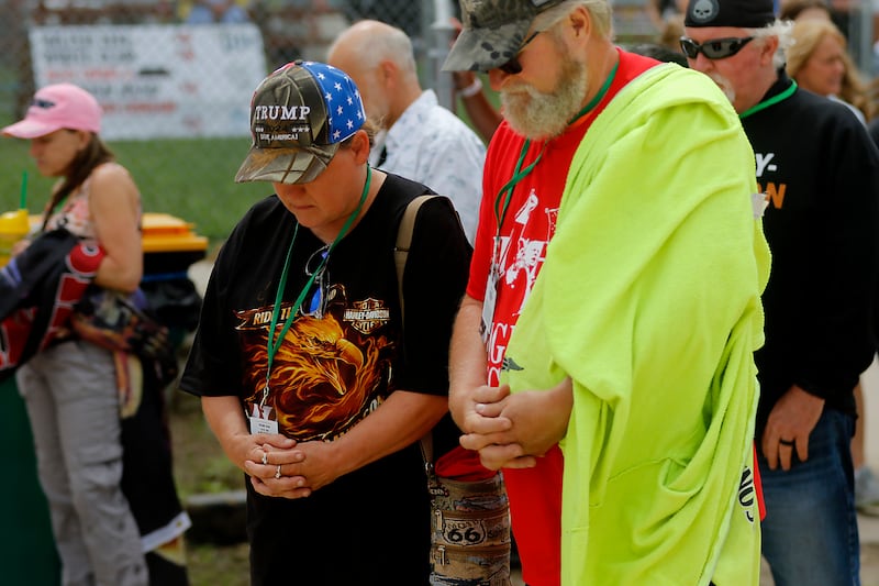 Beth and Robert Severson of Hampshire pray during the Trump Now-Save the American Dream Rally at the McHenry County Fairgrounds on Sunday Aug. 18, 2024, in Woodstock.