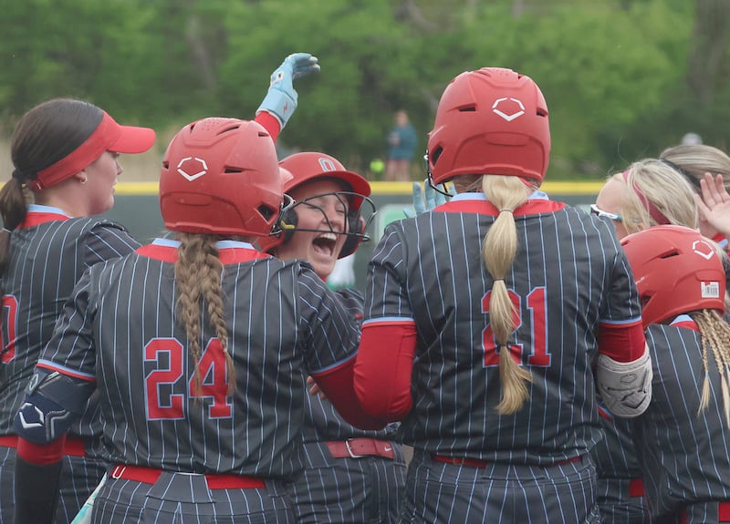 Ottawa's Teagan Darif reacts with teammates at home plate after hitting her first home run against Seneca on Friday, May 1, 2026 at Seneca High School.
