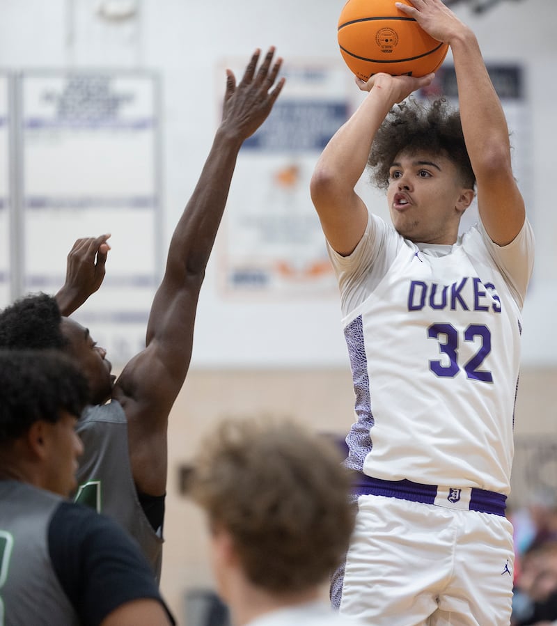 Dixon’s Darius Harrington puts up a shot against Plainfield Central Friday, Jan. 3, 2025, at Dixon High School.