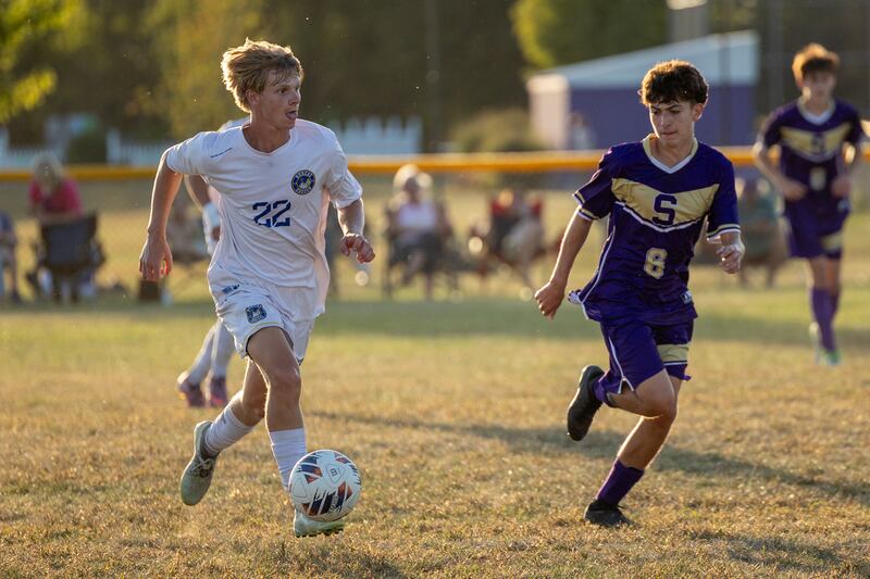 Brady Andrews (22) of Somonauk/Leland/Newark dribbles ball forward as Damien Gonzalez (6) of Serena follows on Monday, Sept. 29, 2025, at Serena High School in Serena.