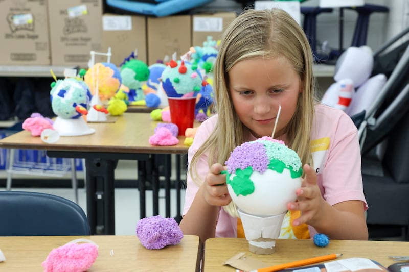 Lila Saineghi, 9, of Bourbonais, focuses on creating a planet during the Space Morphers program as part of Camp Invention on Wednesday, June 10, 2026, at Liberty Intermediate School in Bourbonnais.