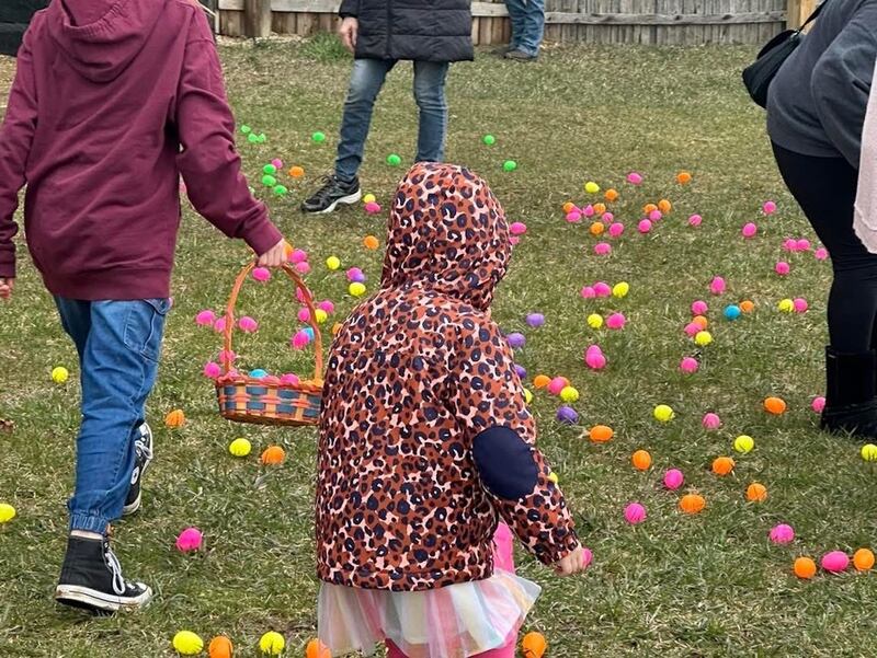A young participant prepares to choose from the colorful array of eggs during the 2024 Bremer Team Easter Egg Hunt at the McHenry Outdoor Theater. This year's hunt takes place Saturday, April 12, and for the first time will include an adult component with prizes.