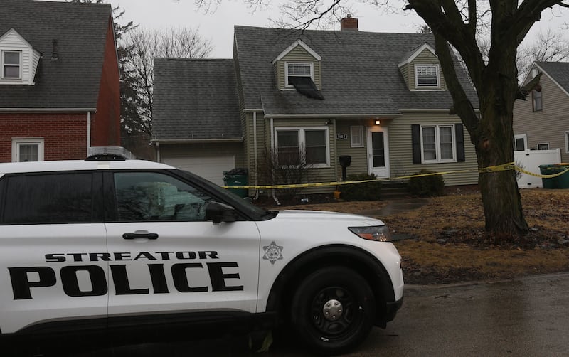 A Streator Police officer sits outside a home in the 1100 block of East Elm Street on Tuesday, March 4, 2025 in Streator.