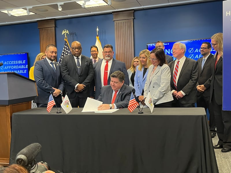 Joliet Junior College President Dr. Clyne Namuo joined Governor JB Pritzker and other state officials to sign the Illinois Dual Credit Quality Act on Monday, June 30, 2025.
