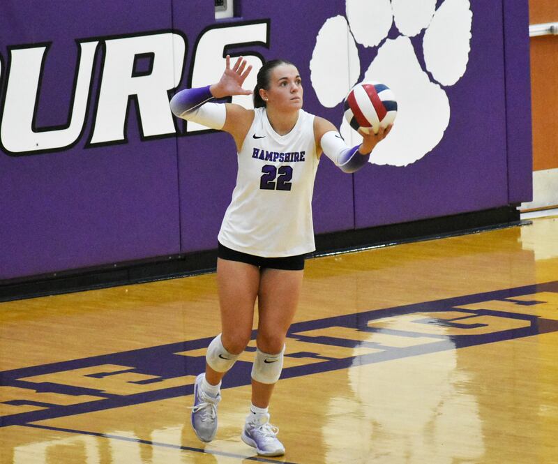 Hampshire's Kylie Lambert prepares to serve during the team's Fox Valley Conference volleyball match against Jacobs on Tuesday evening.