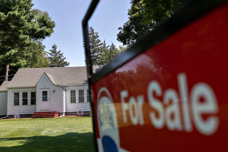 A for sale sign is seen in the front yard of a home in Rock Falls on Friday, August 15, 2025. For many first-time buyers, the idea of purchasing a home can feel overwhelming, especially when navigating mortgages, credit scores and down payments.