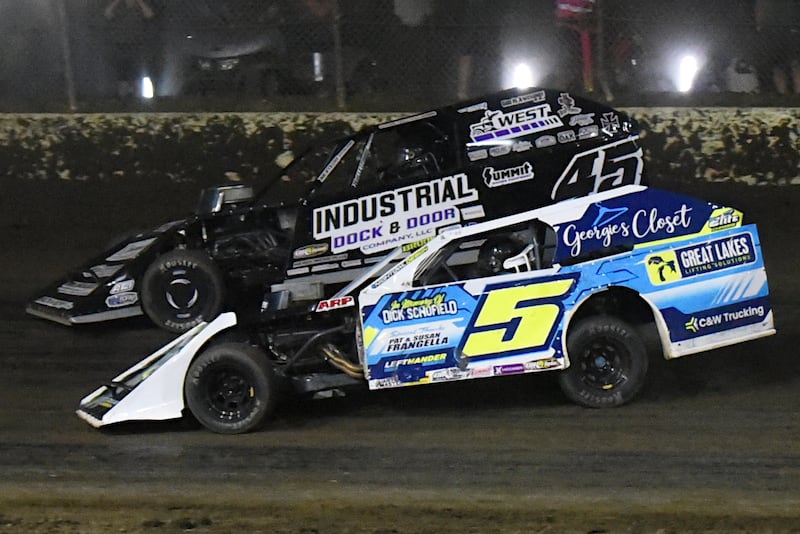 Steven Brooks (5) goes for an inside pass on Chase Holland during the DIRTcar Summit Modified Nationals feature race at Kankakee County Speedway Wednesday, June 11, 2025.