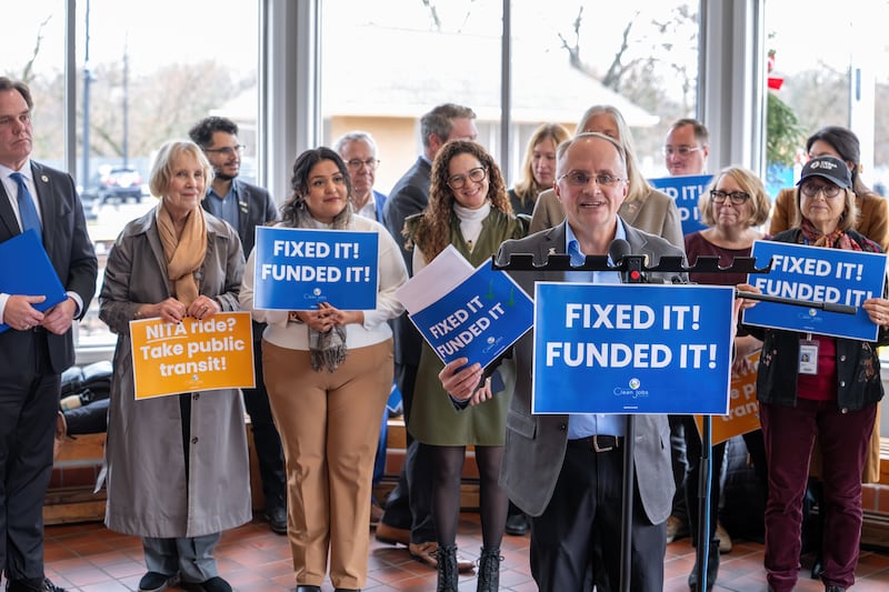 State Rep. Matt Hanson, D-Montgomery, speaks in support of the newly passed Northern Illinois Transit Authority Act – known as NITA – at a news conference Nov. 25, 2025 at the Geneva's Metra station. Also present are Geneva Mayor Kevin Burns (far left), Kane County Board Chair Corinne Pierog; State Rep. Dagmara Avelar, D-Bolingbrook; State Rep. Mary Beth Canty, D-Arlington Heights; and far right Kane County Board Member Mavis Bates, D-Aurora.