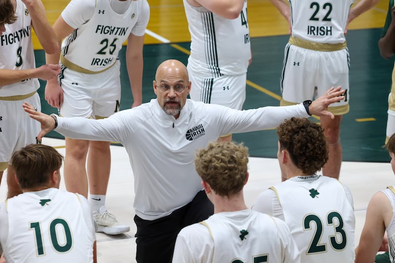 Bishop McNamara head coach Adrian Provost talks to players in a timeout during the Fightin' Irish's 62-25 victory over Chesterton Academy on Wednesday, Jan. 7, 2026.