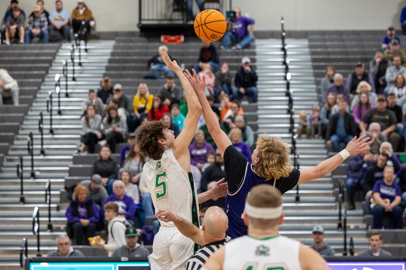 Sebastian Deering of Seneca (5) and Tyler Steffa of Lexington elevate for the championship game jumpball on Saturday, Dec. 28, 2024, at Seneca's Shipyard Showdown.