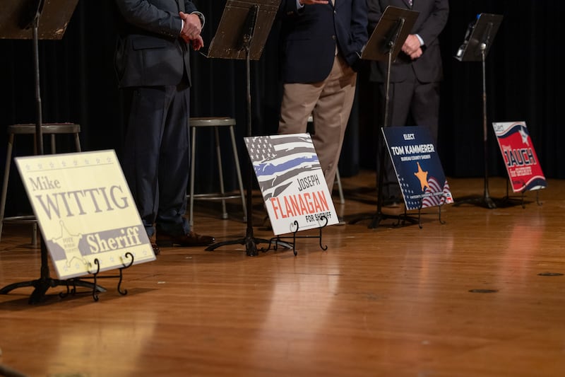 Candidates for Bureau County Sheriff signs are propped on stage at the Bureau County Sheriff Forum on Tuesday, March 3, 2026 at Princeton High School's Auditorium.