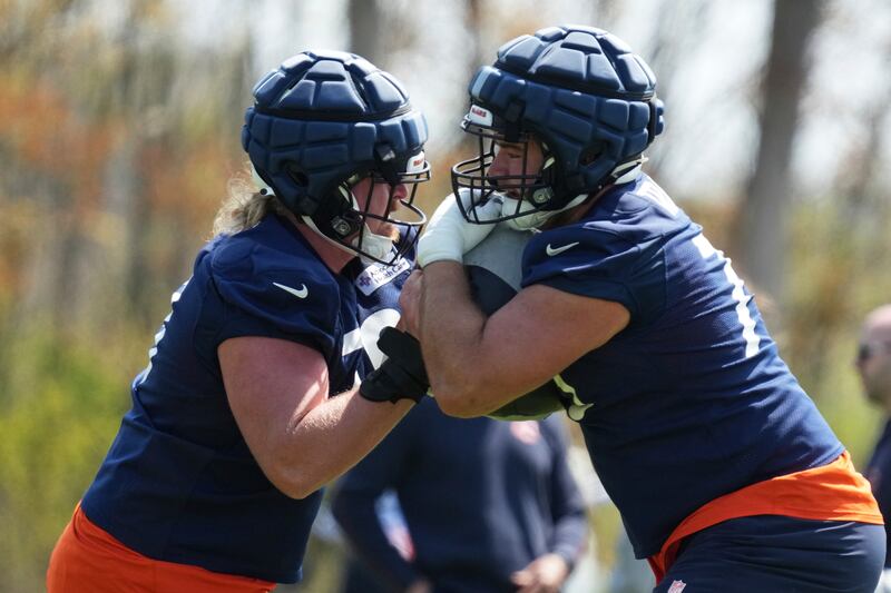 Chicago Bears offensive line Ozzy Trapilo, right, works with offensive line Emmit Bohle during the NFL football team's rookie camp in Lake Forest, Ill., Saturday, May 10, 2025. (AP Photo/Nam Y. Huh)