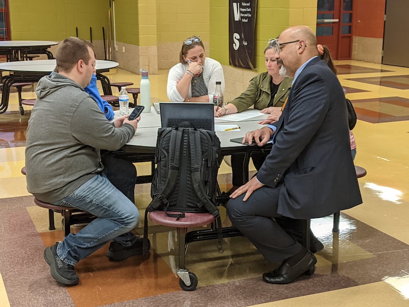Dist. 308 Superintendent Andalib Khelghati, right, listens to community members during a facility planning workshop at Murphy Junior High School in Plainfield on Sept. 10, 2025.
