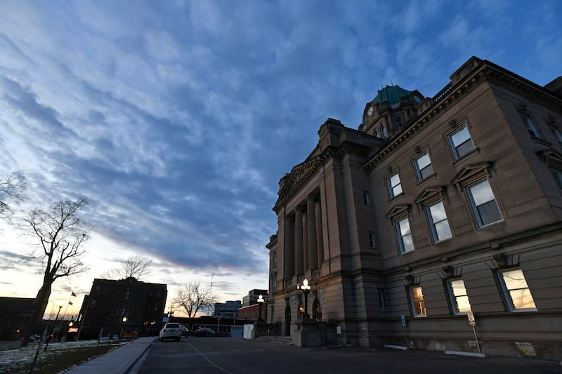 The sun sets behind the Kankakee County Courthouse on Jan. 12, 2022.