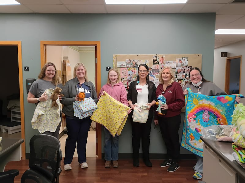 Thanks to community donations, the 4-H Cares Project donated 25 tied blankets, 33 crocheted baby hats, 17 baby quilts, and 51 handmade sewn stuffed animals to OSF Saint Katharine Medical Center for the Pediatrics Department, Emergency Department, OB, and ambulance services.