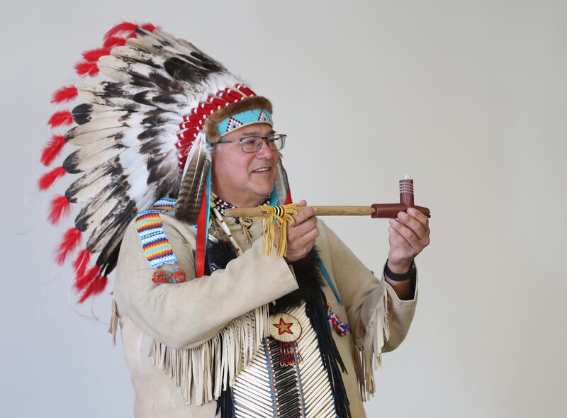 Chief Gerald Savage holds a prayer pipe that the Native Americans used in prayer rituals during a presentation to students at Illinois Valley Community College on Wednesday, Nov. 2, 2022 in Oglesby,.
