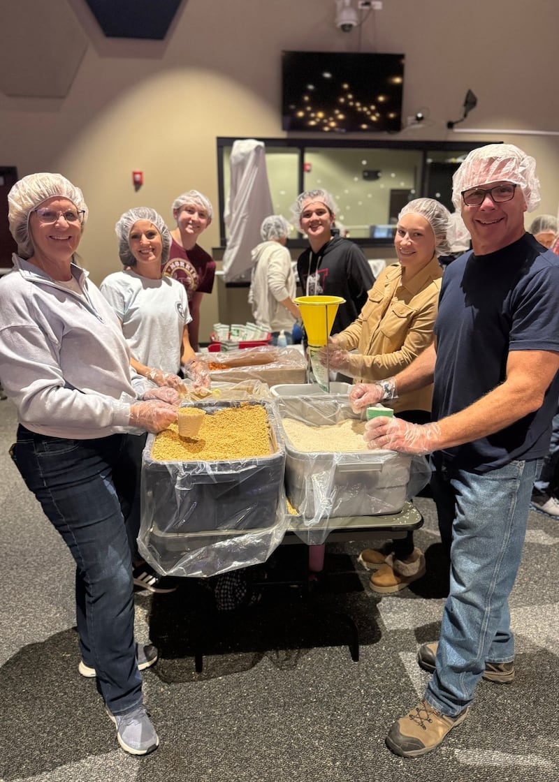 Village Christian Church volunteers prepare and pack meals to be distributed to communities where access to consistent, nutritious food is limited.