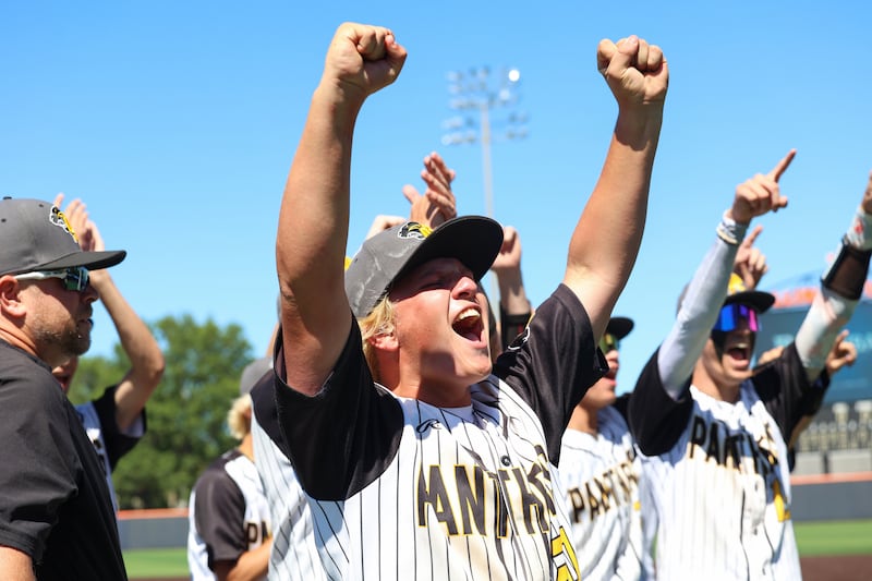 Putnam County's Traxton Mattingly celebrates with teammates as they turn toward their cheering fan section following their 4-3 victory in eight innings over North Clay in the IHSA Class 1A State semifinals on Friday, June 12, 2026, at the University of Illinois in Champaign.