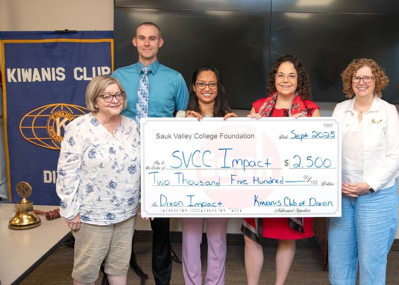 Sauk Valley Community College's Impact Program received a $2,500 donation from the Kiwanis Club of Dixon to support Dixon High School Impact Program students. From left to right, Margaret Tyne, Andrew J. Katzberg, Kora Bajrami, Lori Cortez, and Nancy Hammitt pose with the check.