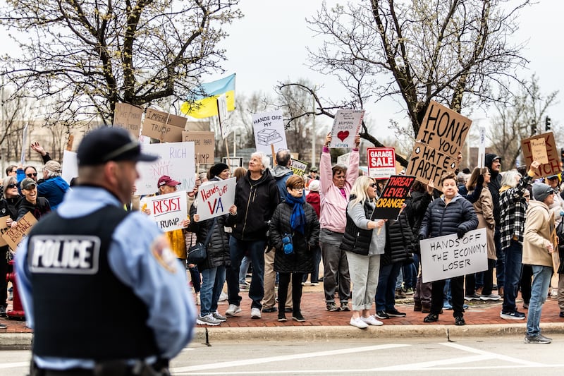 Attendees line Jefferson Street in downtown Joliet during the Hands Off protest on April 5, 2025. The rally was part of a nationwide movement on Saturday to protest policies and actions of the Trump administration and Elon Musk.