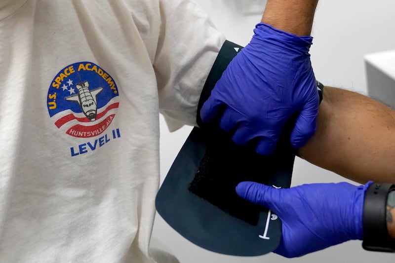 Julio Figuera, 43, has his blood pressure checked at the Cook County, Ill., medical clinic on Monday, Oct. 16, 2023, in Chicago. (AP Photo/Charles Rex Arbogast)