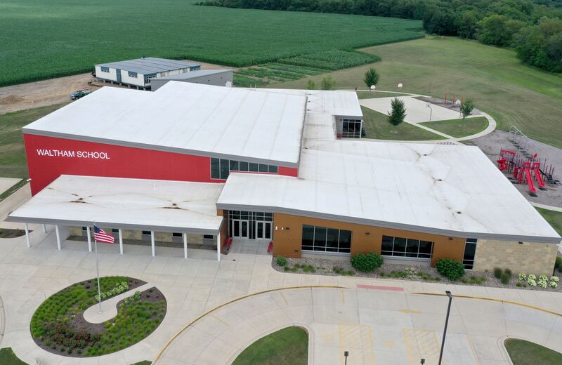 An aerial view of Waltham School on Monday, July 8, 2024 in Utica. Crews installed four 70 x 70 modular classrooms on the new property next to the school.  The school, built in 2018, has already outgrown its 240 student capacity and placed the four classrooms next to the school.