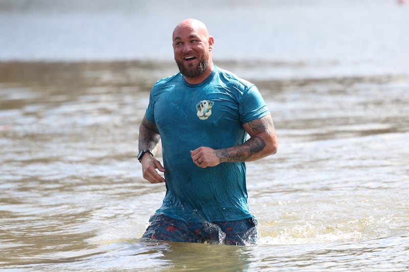 Will County Sheriffs deputy Mike Sims heads back to shore after jumping in the cold water at the annual Law Enforcement Torch Run Polar Plunge for the Special Olympics on Saturday, Mar. 9th in Braidwood.