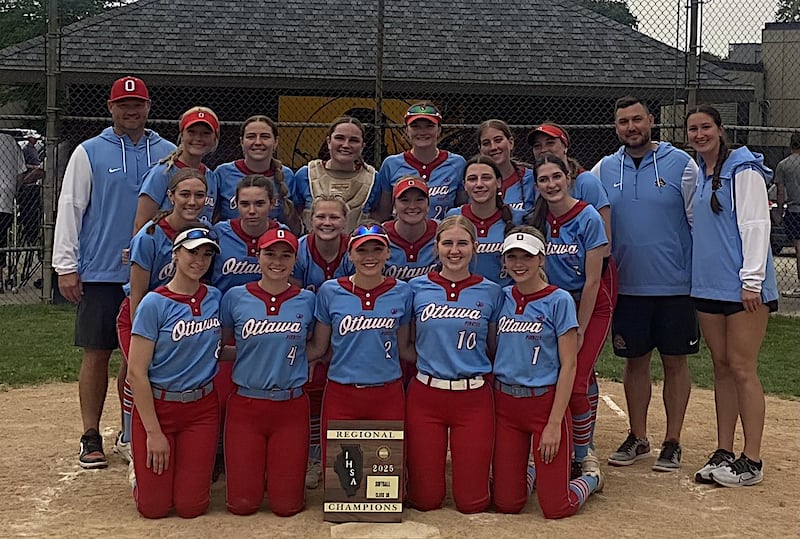 Ottawa's softball team shows off its third straight regional championship plaque after beating Morris 3-1 on Friday.