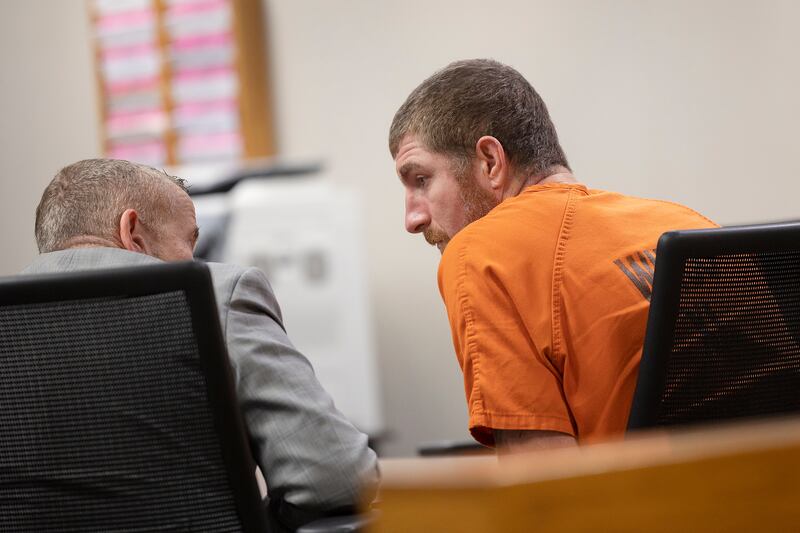 Attorney Jim Mertes speaks with Kyle Cooper on Friday, April 4, 2025, in Whiteside County Circuit Court in Morrison.