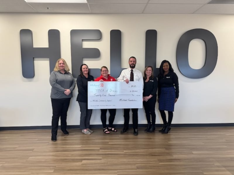 Heather Grobe (third from left), and Andy McFarlane, (third from right), both of the YMCA of Dixon, accept a $25,000 commitment check from (from left) Sara Beauchamp, Nicole Jones, Kirsten Crawford and Martesha Brown, all of Midland States Bank..