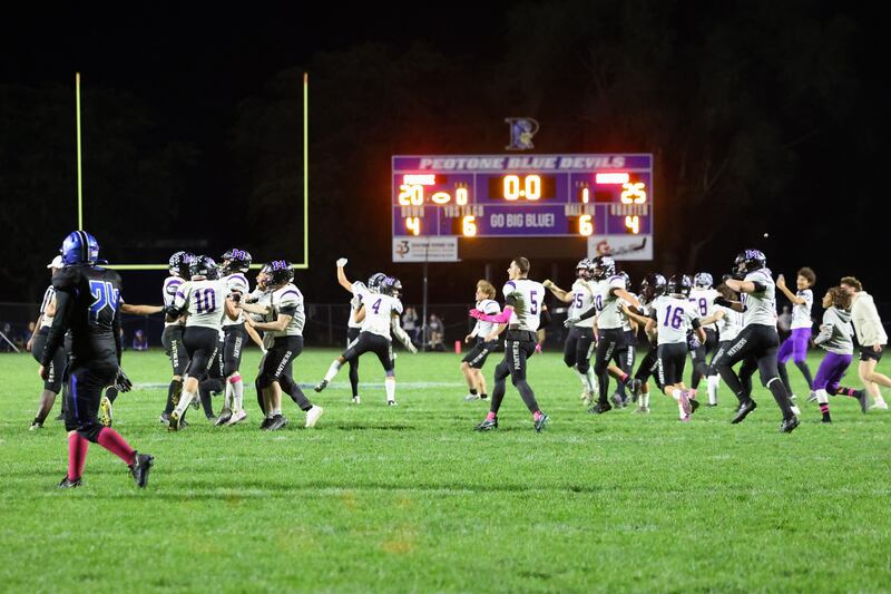 Manteno players rush to celebrate as they secured a 25-20 victory over Peotone on Friday, Oct. 17, 2025, in the annual Rumble on Route 50 rivalry game.