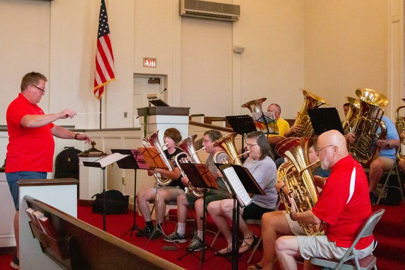 (Illinois State University’s Tuba/Euphonium professor) Andy Rummel conducts Tuba Players for the performance of America the beautiful at the third annual Summertubafest on Sunday, July 28, 2024 at the First Congregational Church in Peru.